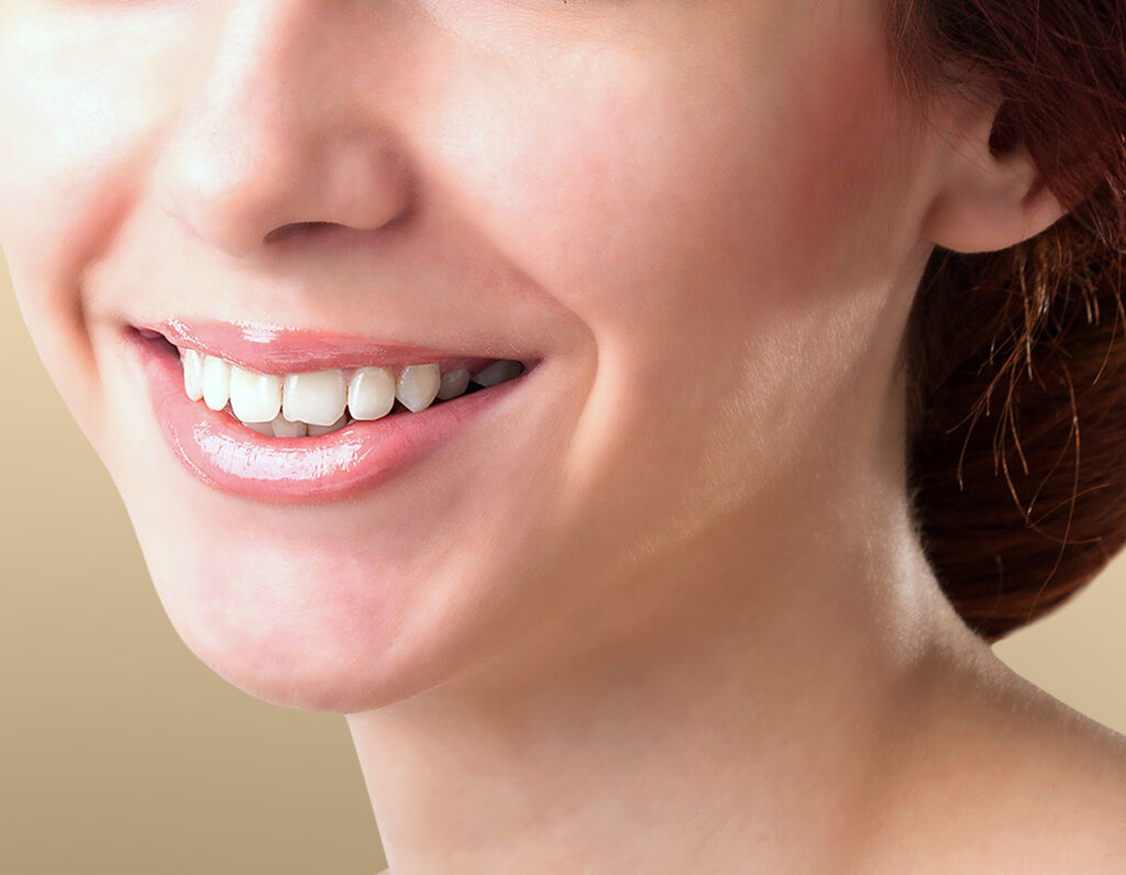 Close-up of a woman with a healthy smile and braces