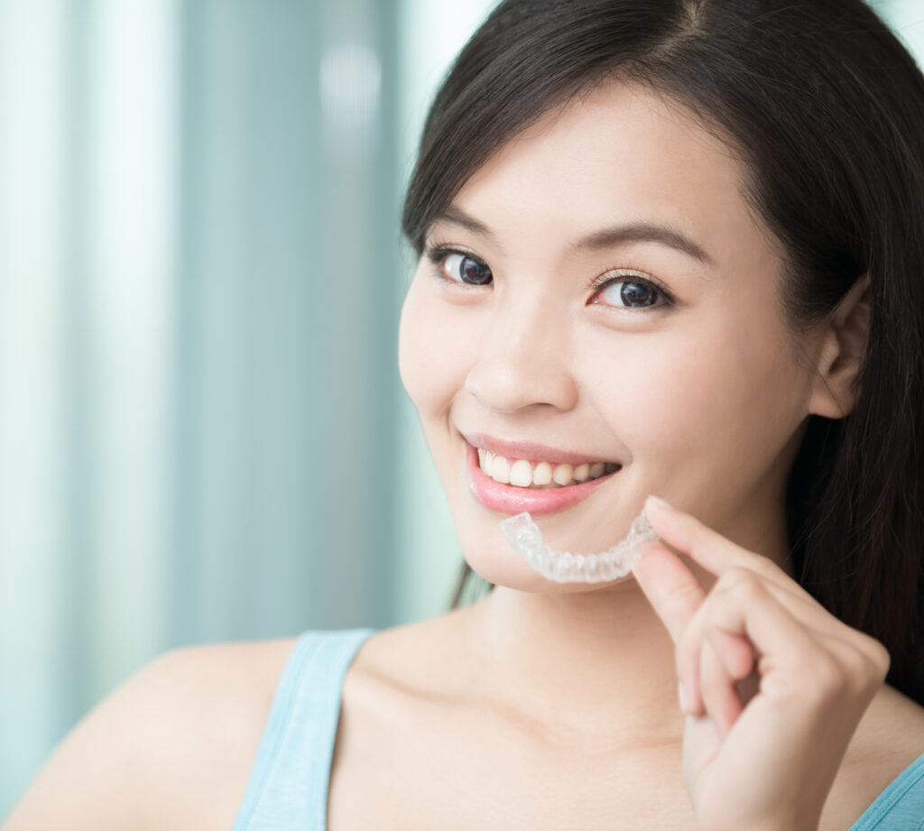 Woman wearing invisible braces for orthodontic care