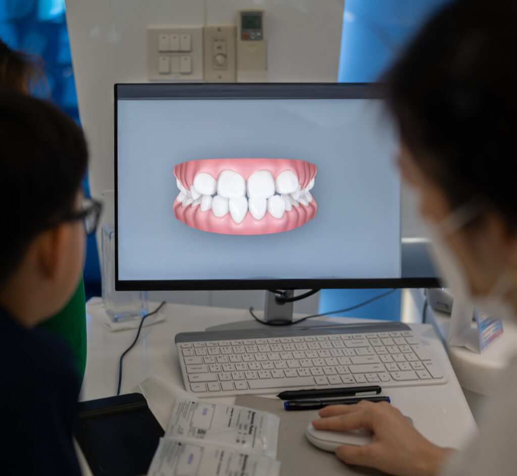 A child receiving an orthodontic consultation for braces