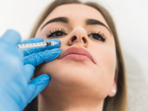 Woman receiving fillers for gummy smile treatment