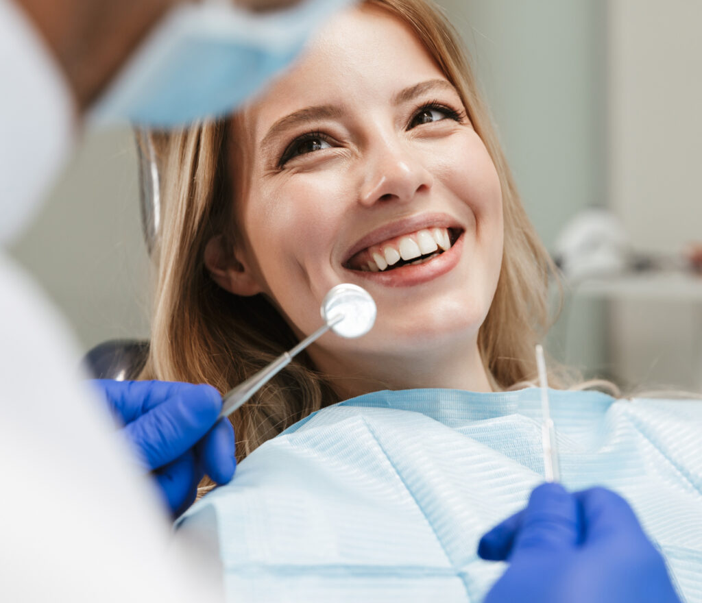 Woman in dental chair receiving same-day emergency treatment