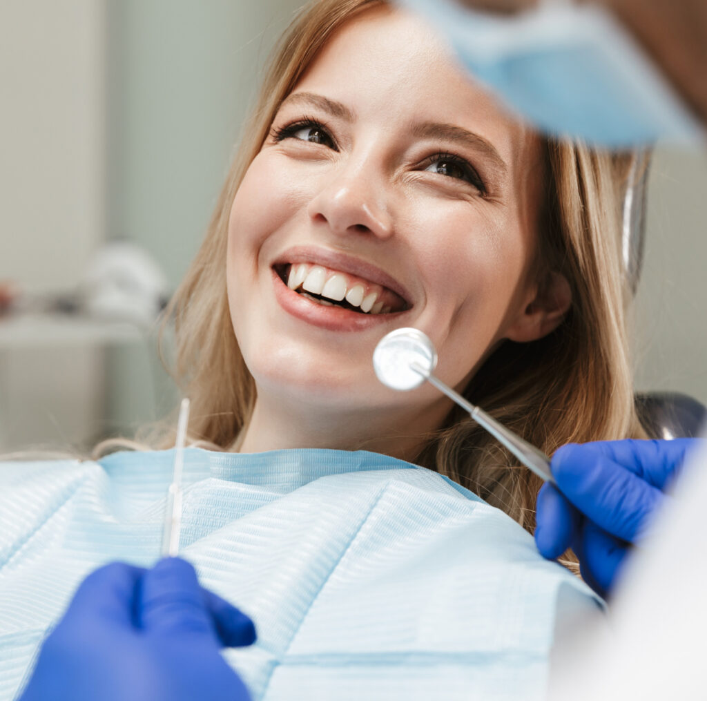Woman in dental chair receiving bone graft treatment